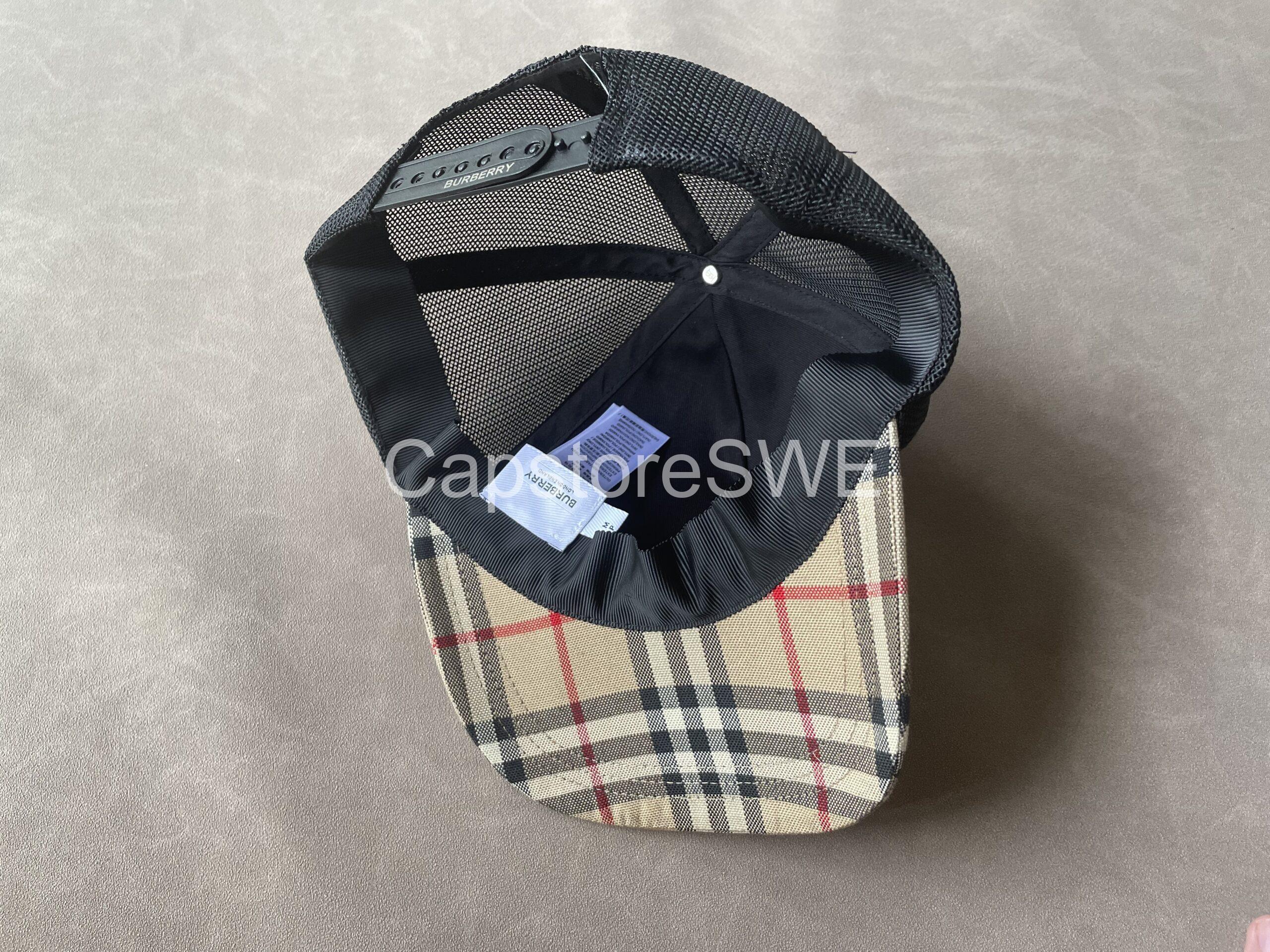 the burberry vintage check trucker cap combines the house’s iconic heritage pattern with a sporty, contemporary silhouette. designed with the classic beige vintage check on the front panels and a breathable black mesh back, this cap offers both luxury and comfort. material: cotton front with mesh back color: beige vintage check with black mesh design: classic trucker cap style brim: curved brim for a sporty look fit: adjustable back strap for custom fit unisex: perfect for both men and women this cap merges burberry’s british luxury heritage with modern streetwear energy, making it a versatile everyday statement piece. the burberry vintage check trucker cap combines the house’s iconic heritage pattern with a sporty, contemporary silhouette. designed with the classic beige vintage check on the front panels and a breathable black mesh back, this cap offers both luxury and comfort. material: cotton front with mesh back color: beige vintage check with black mesh design: classic trucker cap style brim: curved brim for a sporty look fit: adjustable back strap for custom fit unisex: perfect for both men and women this cap merges burberry’s british luxury heritage with modern streetwear energy, making it a versatile everyday statement piece.