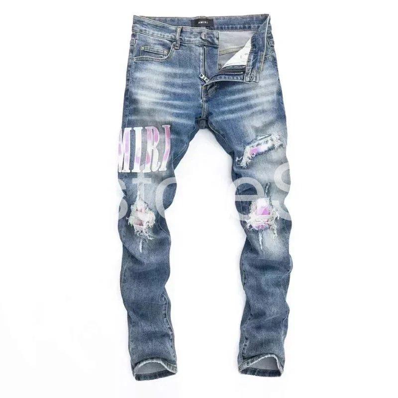 amiri distressed logo patch jeans – blue amiri distressed logo patch jeans – blue