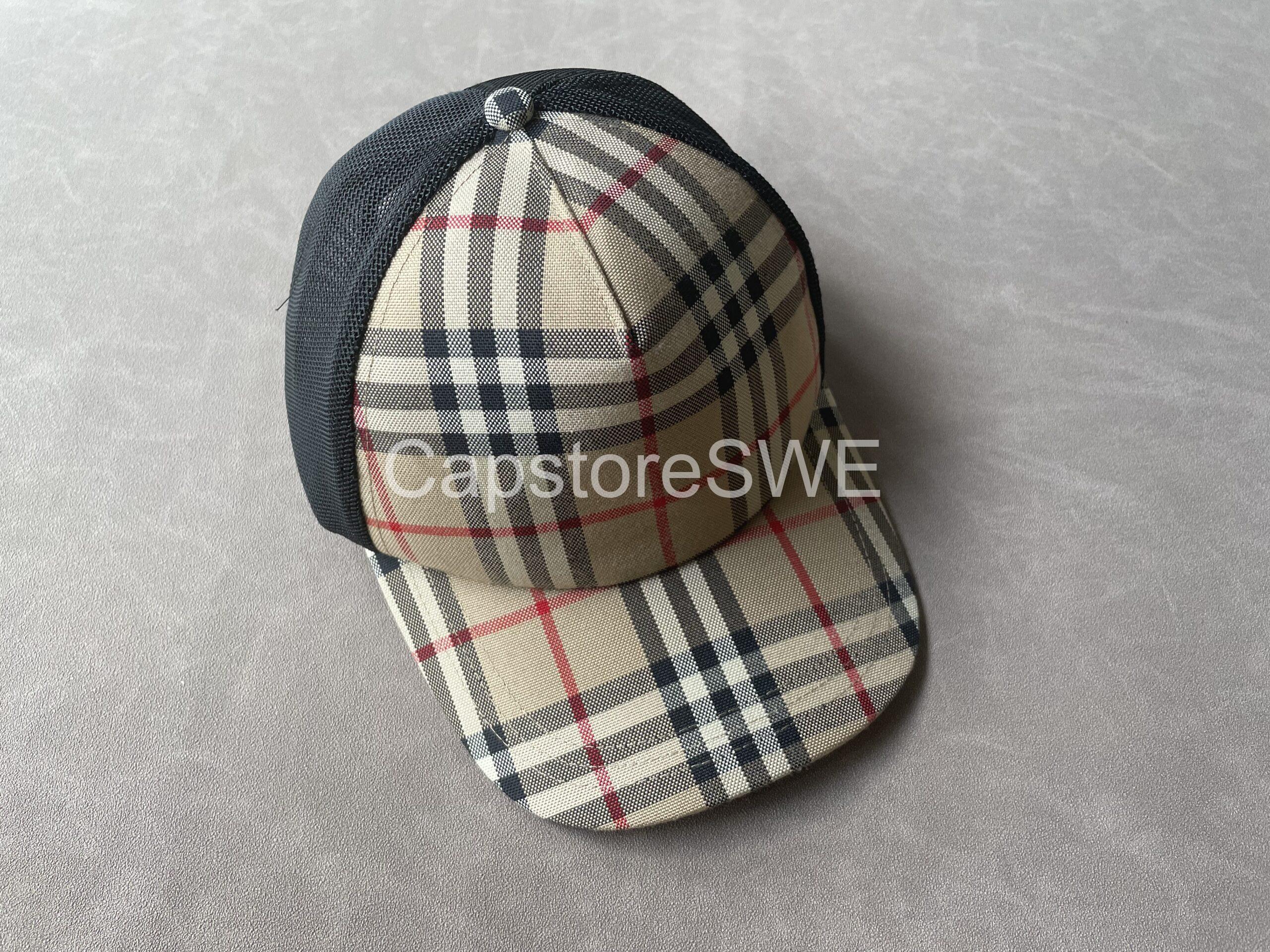 the burberry vintage check trucker cap combines the house’s iconic heritage pattern with a sporty, contemporary silhouette. designed with the classic beige vintage check on the front panels and a breathable black mesh back, this cap offers both luxury and comfort. material: cotton front with mesh back color: beige vintage check with black mesh design: classic trucker cap style brim: curved brim for a sporty look fit: adjustable back strap for custom fit unisex: perfect for both men and women this cap merges burberry’s british luxury heritage with modern streetwear energy, making it a versatile everyday statement piece. the burberry vintage check trucker cap combines the house’s iconic heritage pattern with a sporty, contemporary silhouette. designed with the classic beige vintage check on the front panels and a breathable black mesh back, this cap offers both luxury and comfort. material: cotton front with mesh back color: beige vintage check with black mesh design: classic trucker cap style brim: curved brim for a sporty look fit: adjustable back strap for custom fit unisex: perfect for both men and women this cap merges burberry’s british luxury heritage with modern streetwear energy, making it a versatile everyday statement piece.